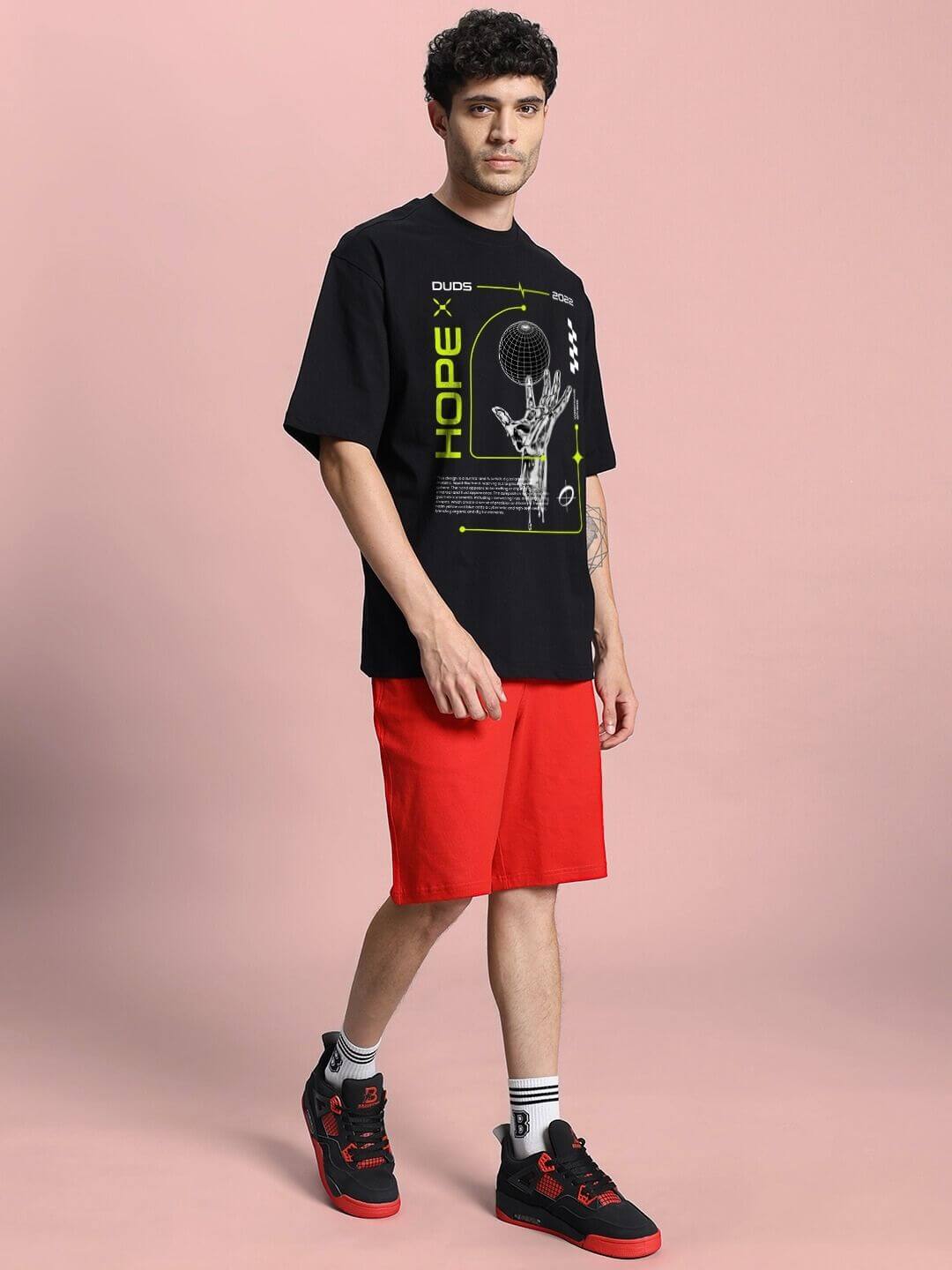 Model wearing HOPE PRINTED OVERSIZED CO-ORD SET BLACK RED, featuring bold prints and relaxed fit for streetwear style.