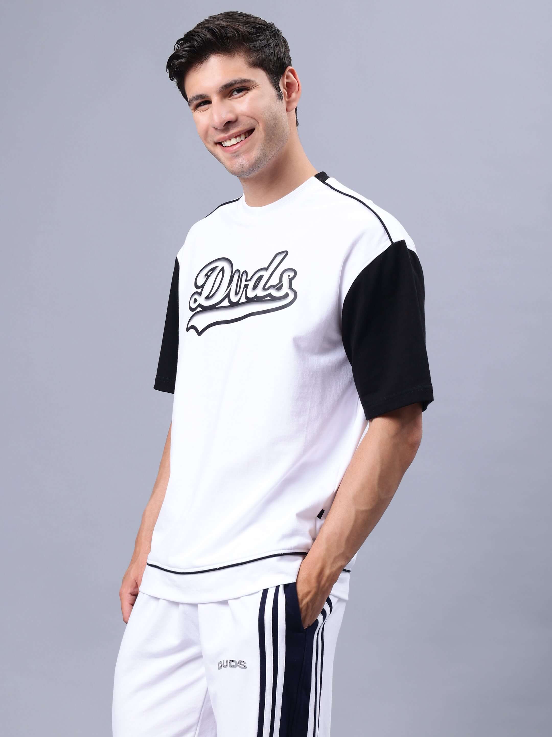 Hunk oversized white-black t-shirt in premium cotton with French terry, elastane; model wearing it, bio-washed, made in India.