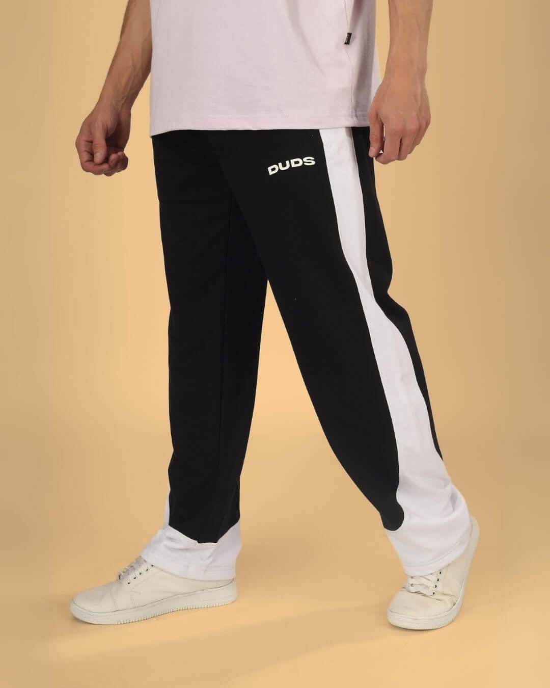 HURTLE BAGGY JOGGERS in black-white by DUDS, worn by a model, offering custom fit options, made by experienced tailors.