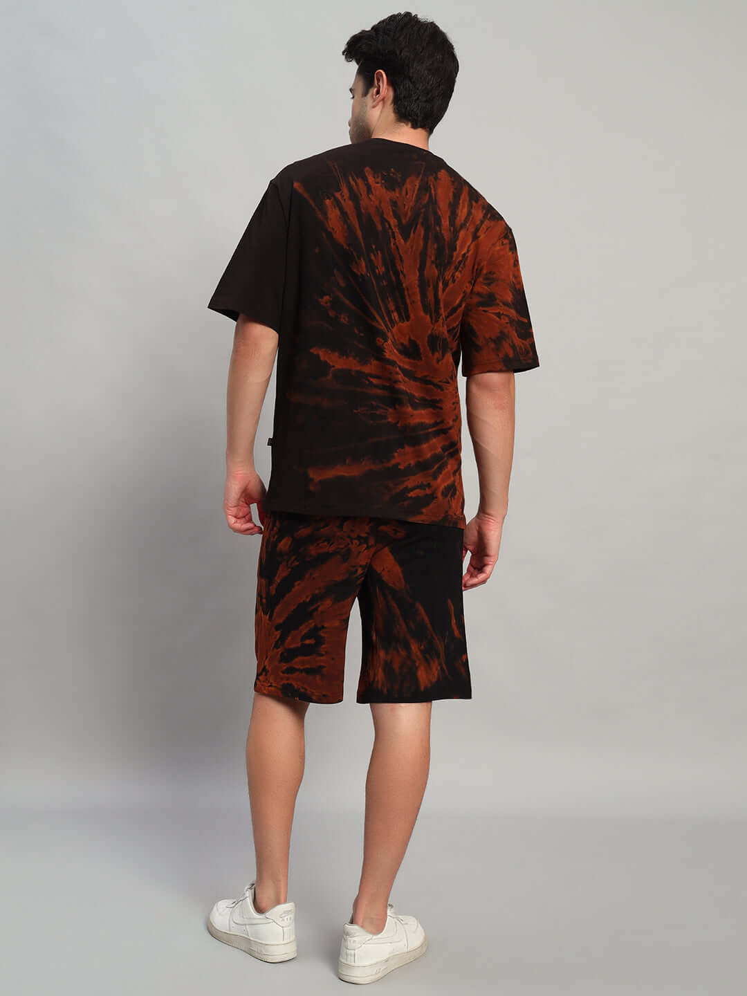 Back view of HUSTLER TIE-DYE CO-ORD SET BLACK worn by a model, showcasing bold streetwear style from WEAR DUDS.