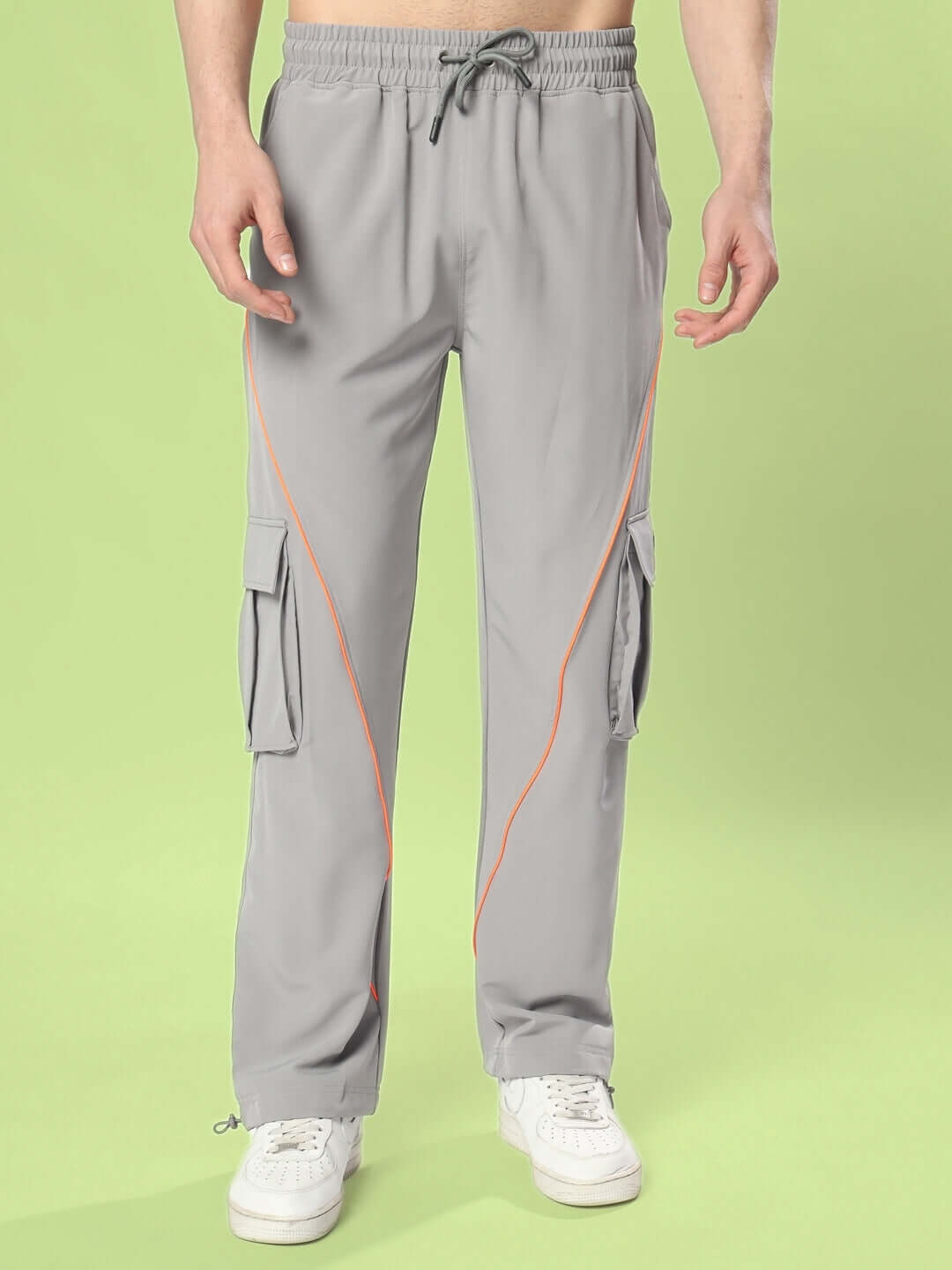 HYPEBEAST grey cargo pants with neon orange accents, featuring adjustable drawstring waist and side pockets for a stylish streetwear look.