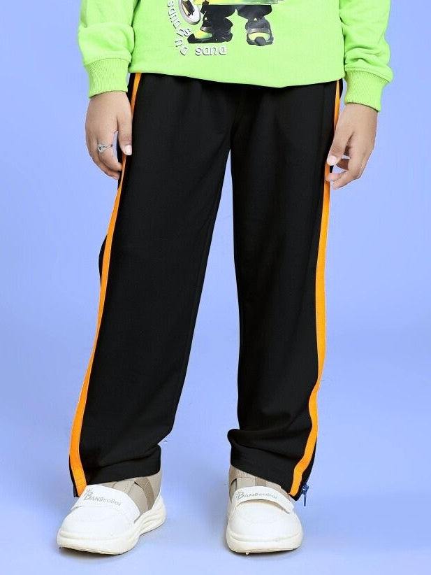 Child wearing IMPERIAL SIDE ZIPPER JOGGER FOR BOYS AND GIRLS BLACK with orange side stripes