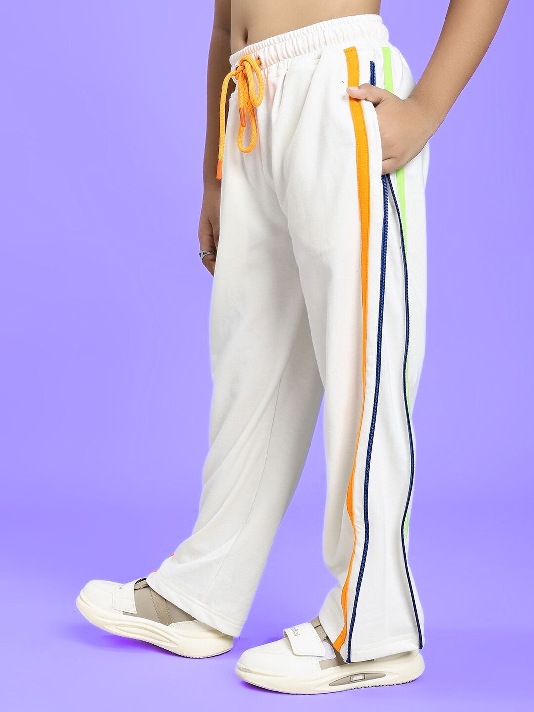 IMPERIAL SIDE ZIPPER JOGGER FOR BOYS AND GIRLS OFF WHITE with colorful side stripes, perfect for versatile and comfortable wear.