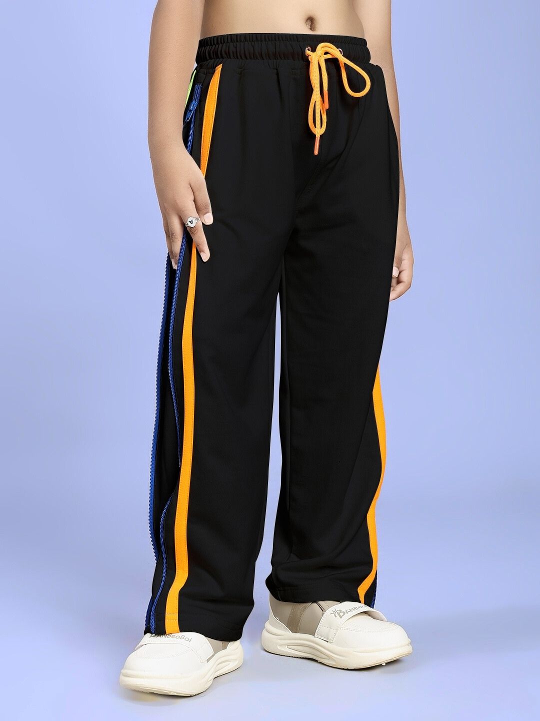 IMPERIAL SIDE ZIPPER JOGGER FOR BOYS AND GIRLS BLACK with colorful side stripes on a child's legs.
