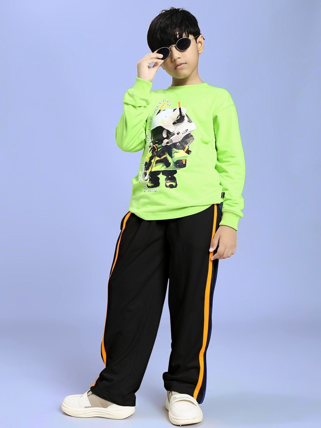 Boy wearing IMPERIAL SIDE ZIPPER JOGGER FOR BOYS AND GIRLS BLACK, highlighting modern style and comfort with trendy side zipper accents.