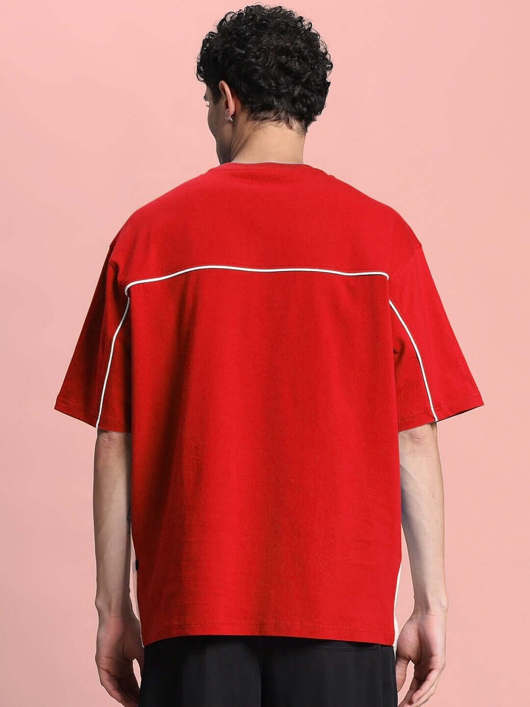 Back view of INDY OVER-SIZED CLASSIC T-SHIRT RED on model, showcasing premium cotton fabric and streetwear style.