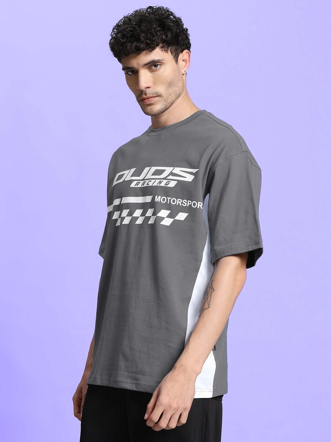 Model wearing INDY OVER-SIZED CLASSIC T-SHIRT GREY, showcasing relaxed style and comfort in premium cotton tee.
