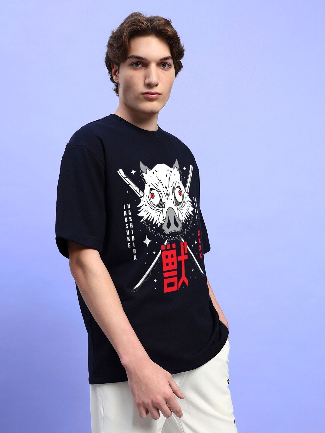 Model wearing INOSUKE PRINT OVERSIZED T-SHIRT BLACK with bold design against a light blue background.