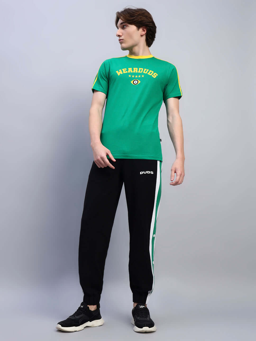 Model wearing Irish regular fit green t-shirt made of 100% cotton, paired with black joggers. Premium 220 GSM fabric, bio-washed.
