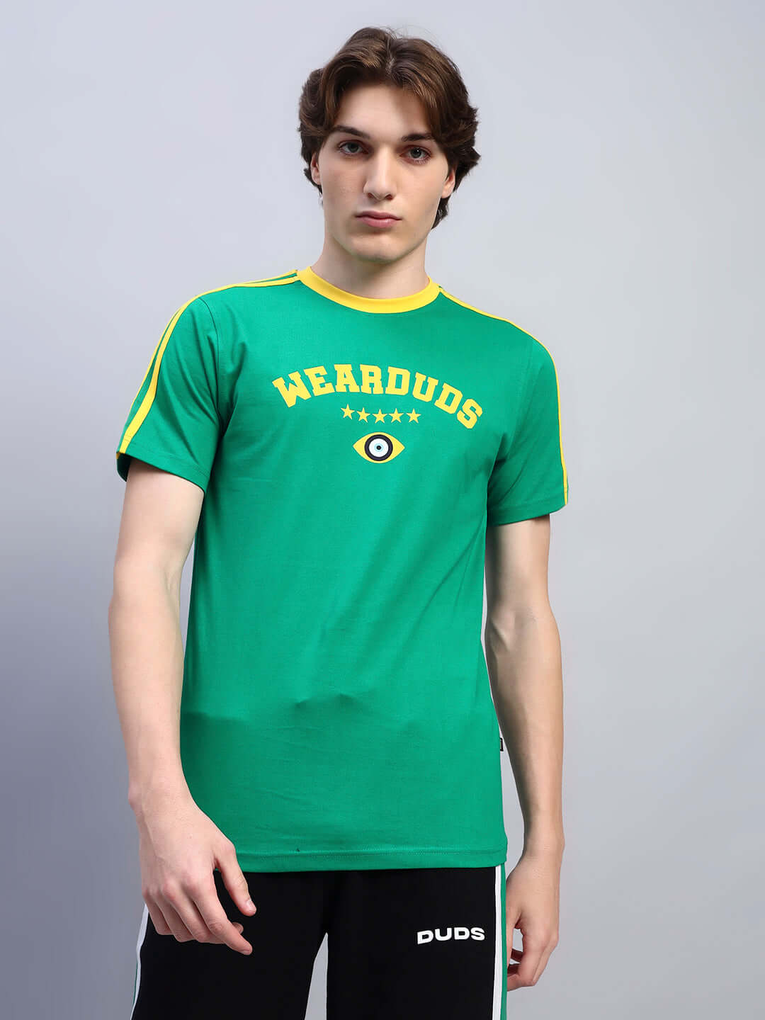 Man wearing a green Irish regular fit T-shirt with yellow details, made of 100% cotton, 220 GSM bio-washed fabric. Premium quality clothing.