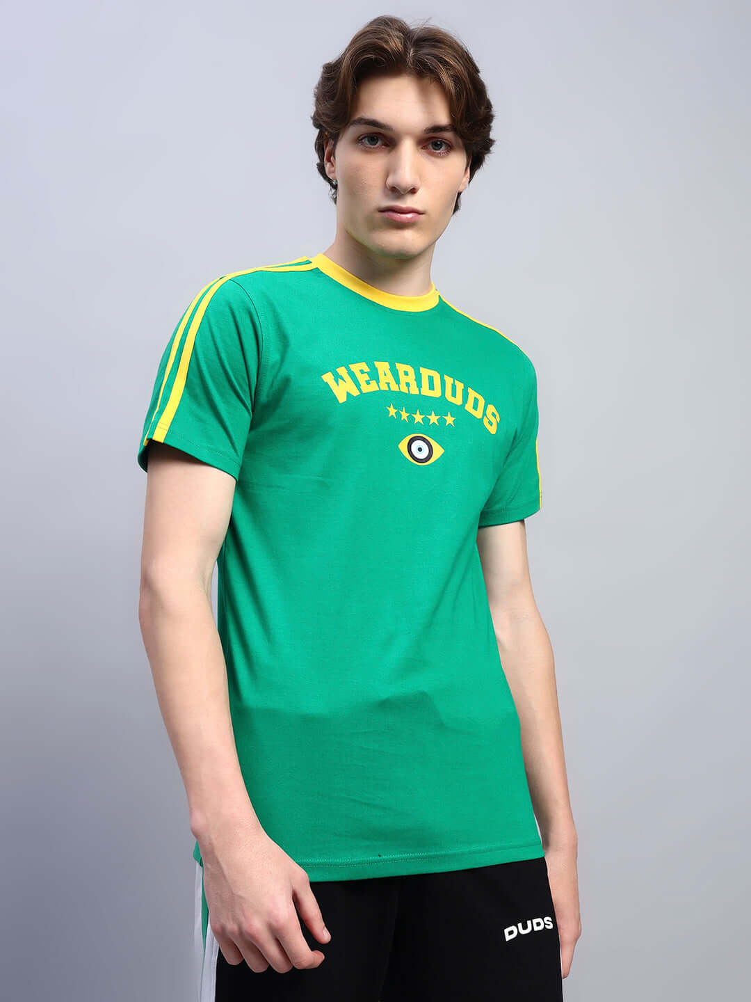 Model wearing a green Irish regular fit t-shirt with yellow stripes and 'wearduds' logo, made of 100% premium cotton, 220 GSM.