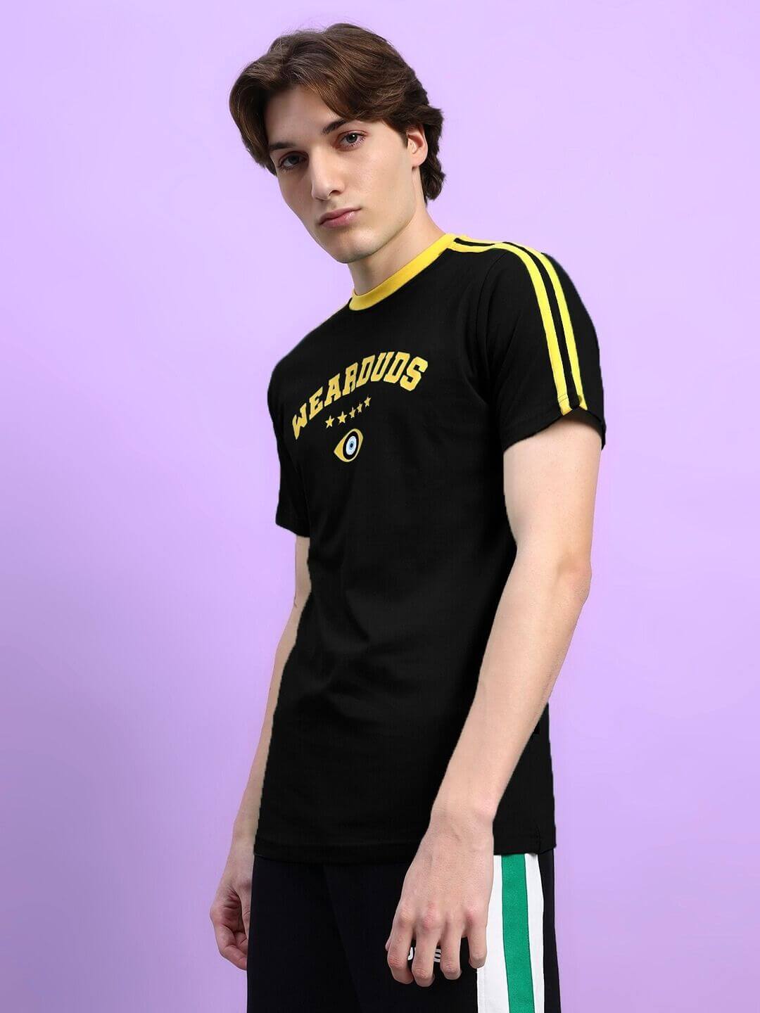 Man wearing IRISH REGULAR FIT T-SHIRT BLACK with side stripes on a purple background