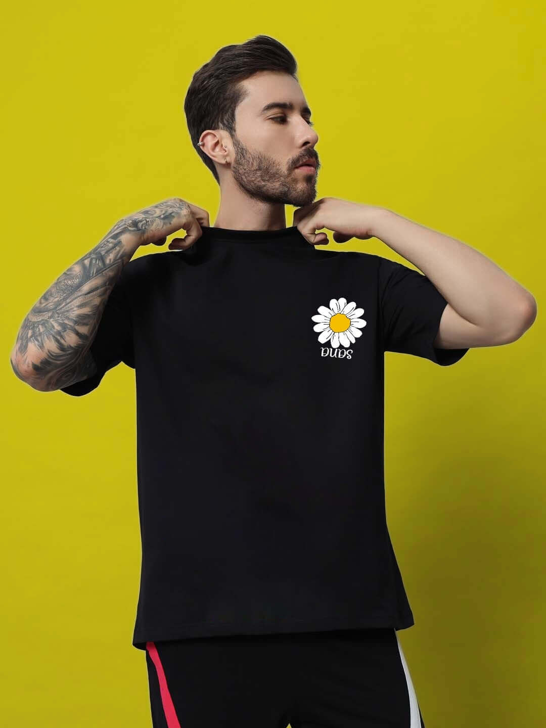 Man wearing IT'S OK PRINTED OVERSIZED T-SHIRT BLACK made of 100% cotton.