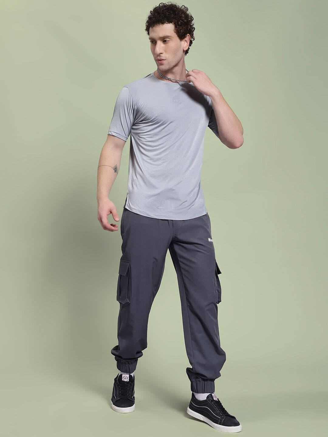 Male model wearing JACK RELAXED FIT MULTI POCKET CARGO DARK GREY showcasing casual style with functional pockets