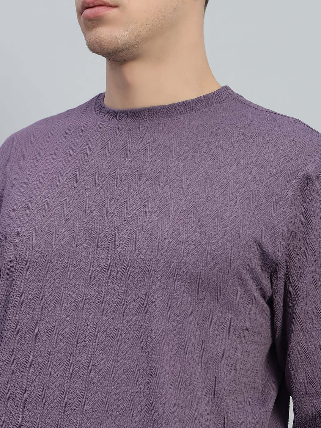 Model wearing JACOB JACQUARD SWEATSHIRT PURPLE with intricate texture, highlighting luxury streetwear design.