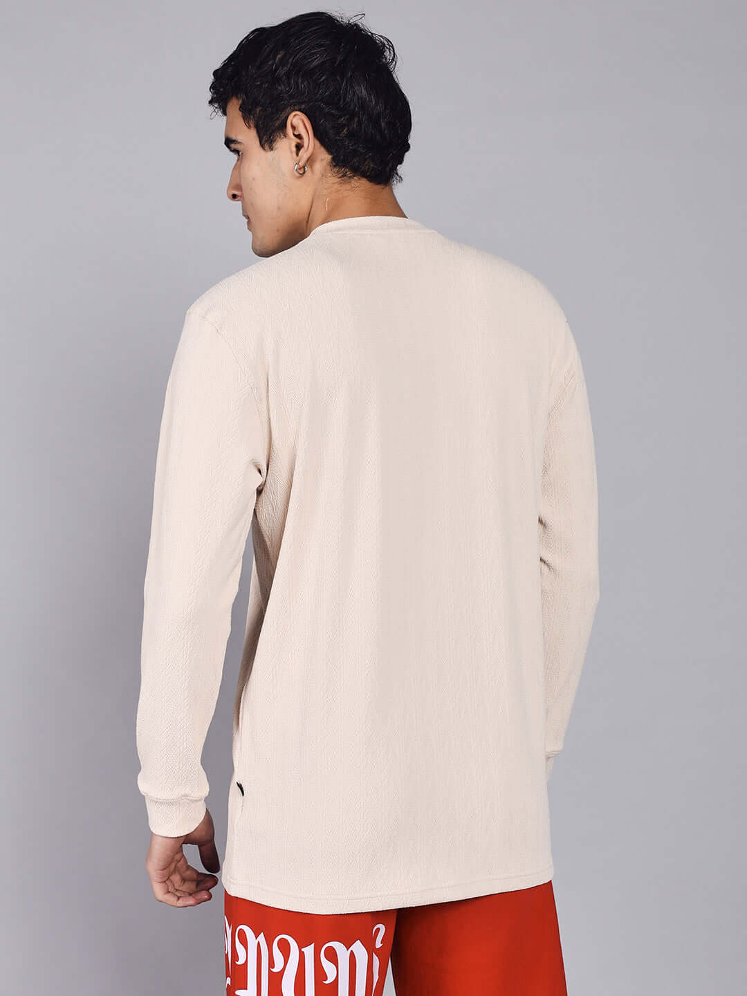 Back view of a cream JACOB SWEATSHIRT made from premium heavy gauge Jacquard Lycra fabric, worn by a man. Cold machine wash recommended.