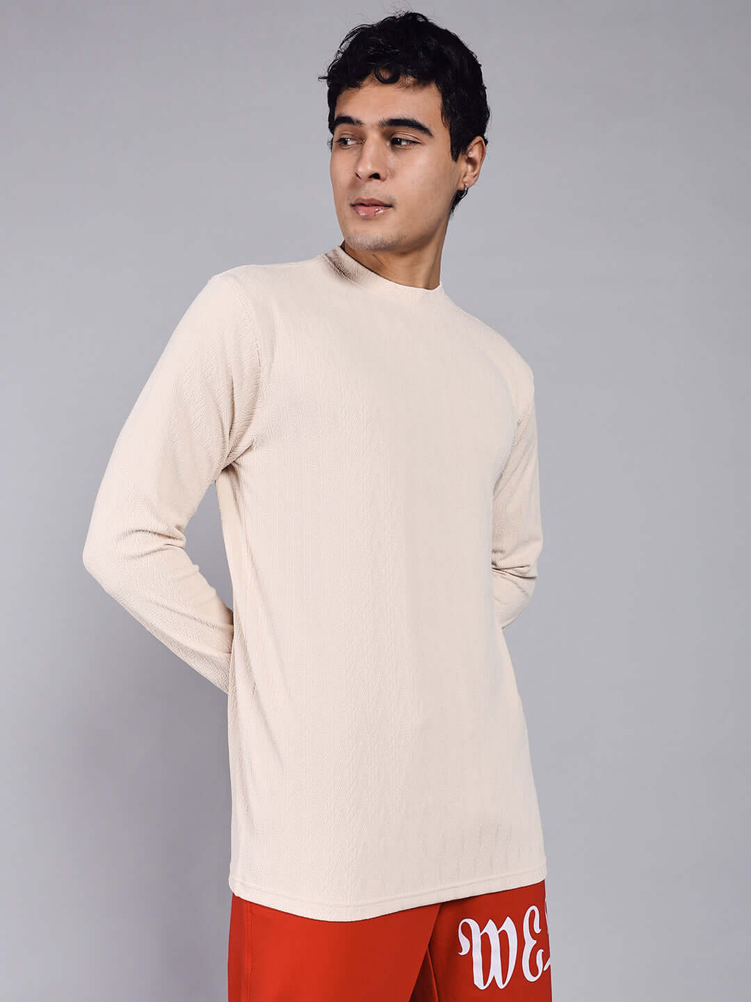 Cream Jacob sweatshirt made from premium heavy gauge jacquard lycra fabric, modeled by a person, showcasing a sleek, modern design.