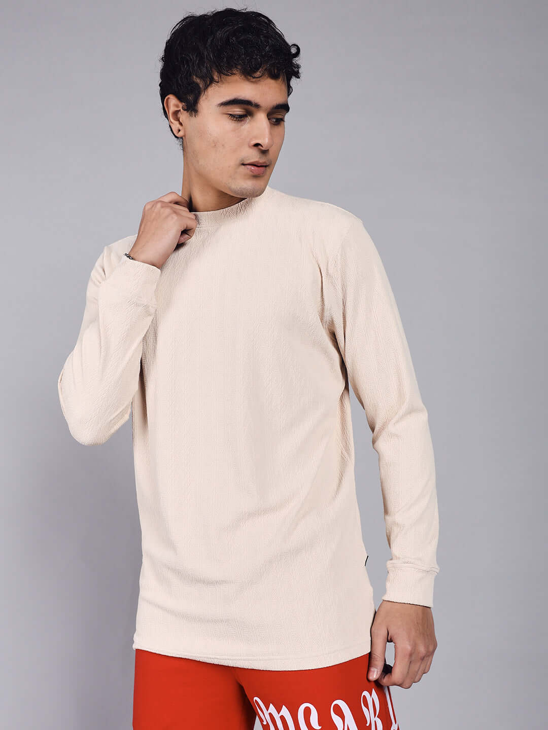 Model wearing JACOB Sweatshirt in cream, made from heavy gauge Jacquard Lycra, emphasizes style and comfort. Ideal for casual wear.