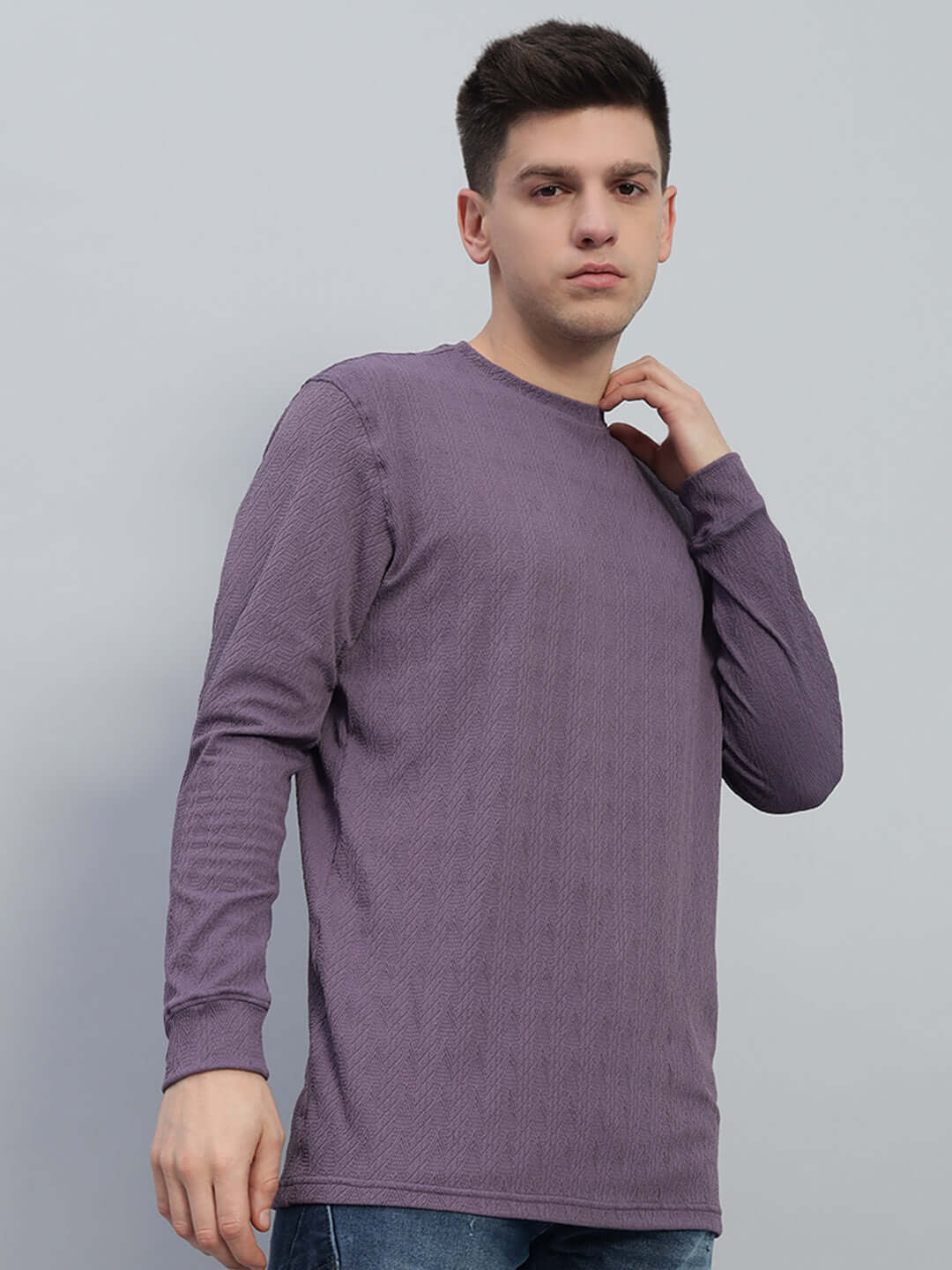 Model wearing JACOB JACQUARD SWEATSHIRT PURPLE, showcasing the rich texture and bold color of this luxurious streetwear piece.