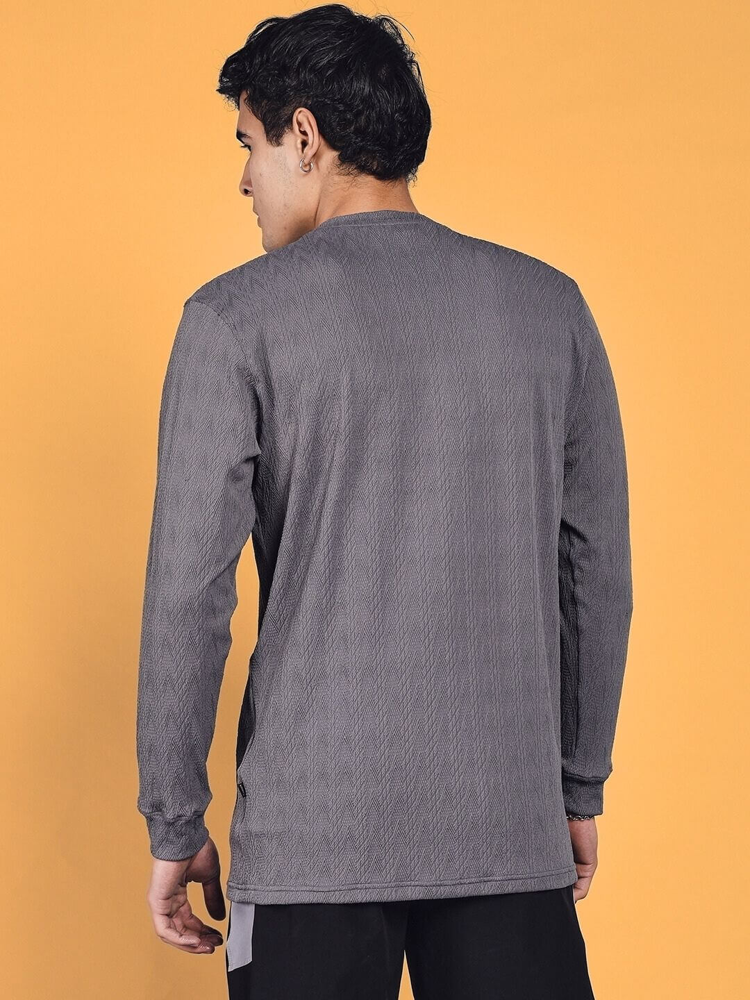 Back view of a grey Jacob sweatshirt in premium jacquard lycra fabric, modeled to show design and fit against a plain background.
