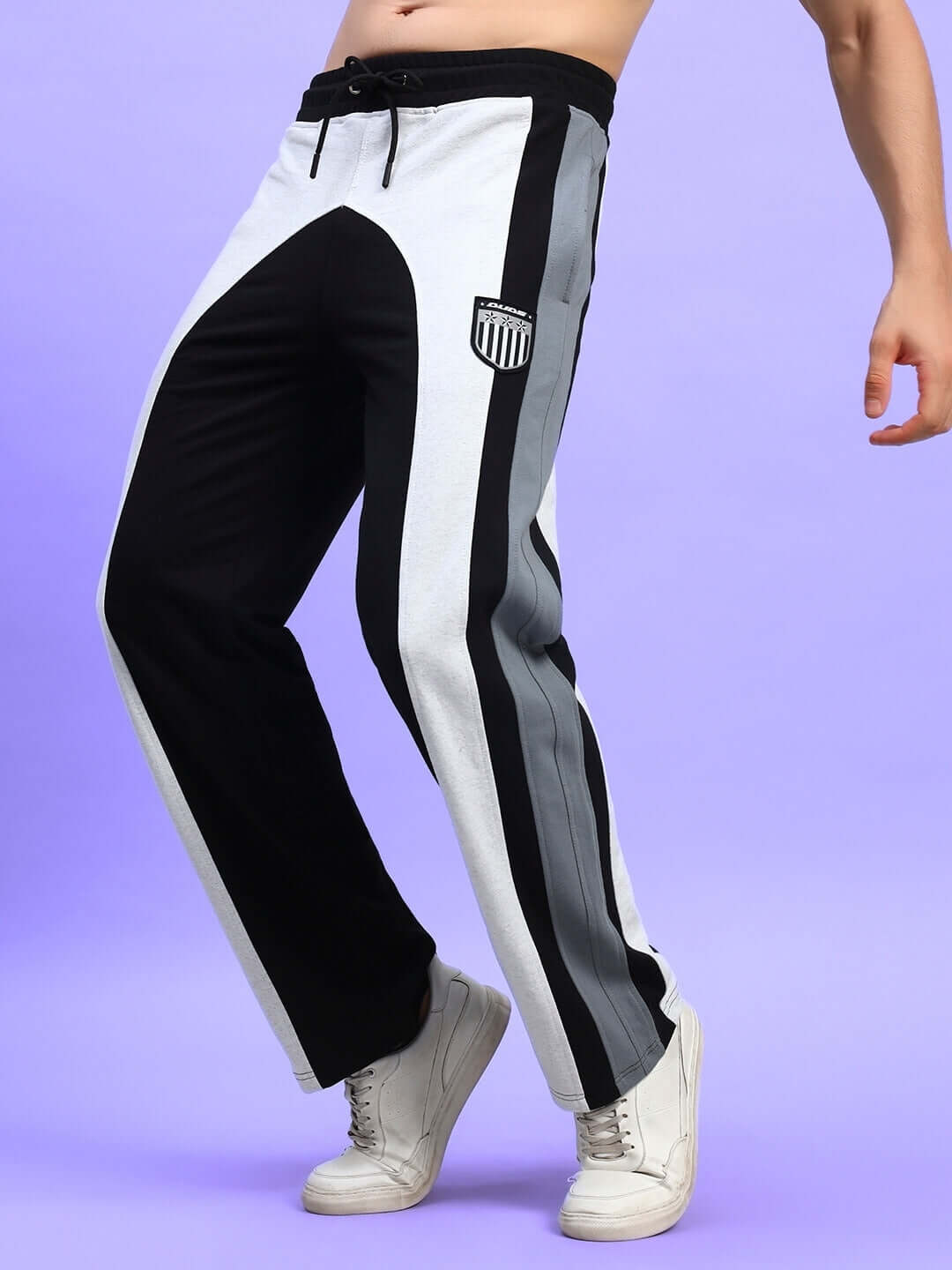 Jamison color block relaxed-fit joggers in black melange-grey, showcasing modern design with customizable fit for comfort.