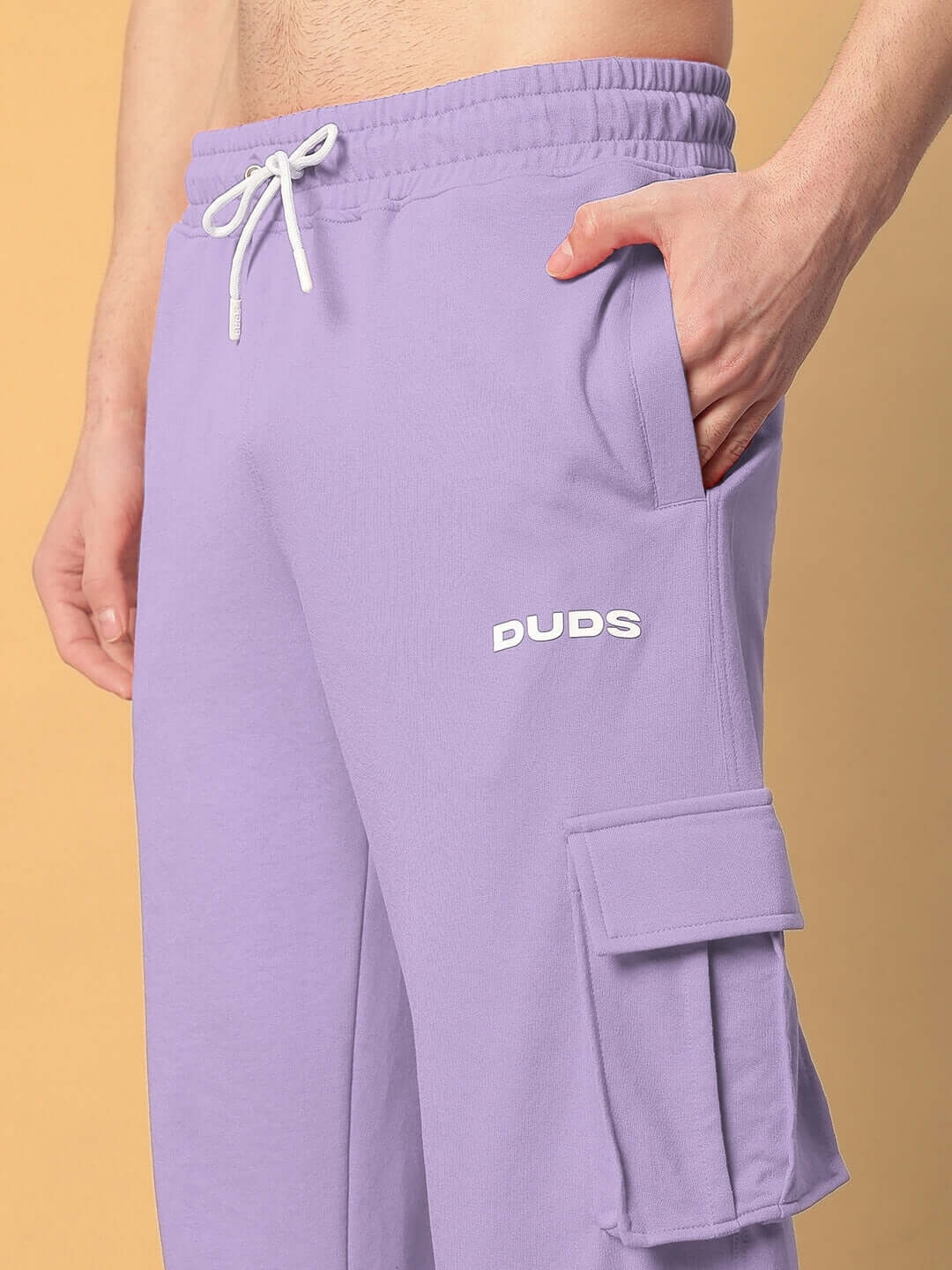 Person wearing lavender JESS 5 Pocket Relaxed Fit Joggers by DUDS, featuring a comfortable elastic waistband and cargo pocket.