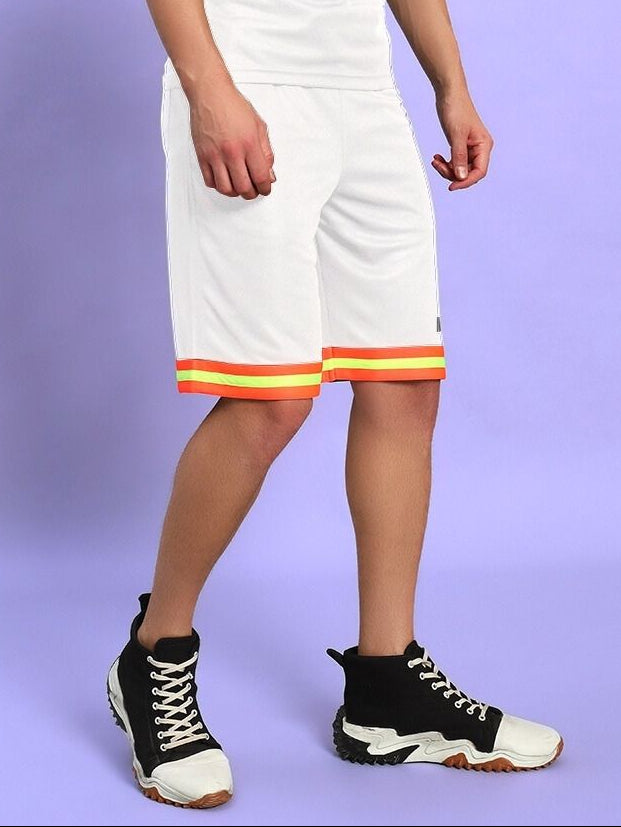 Person wearing JORDAN GYM REGULAR FIT SHORTS WHITE with colorful trim on a purple background