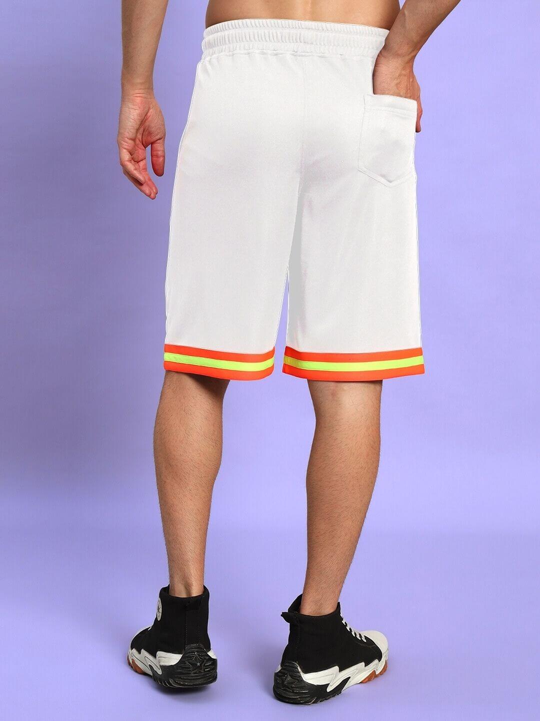 Back view of JORDAN GYM REGULAR FIT SHORTS WHITE worn by model on purple background showing athletic fit and colorful trim.