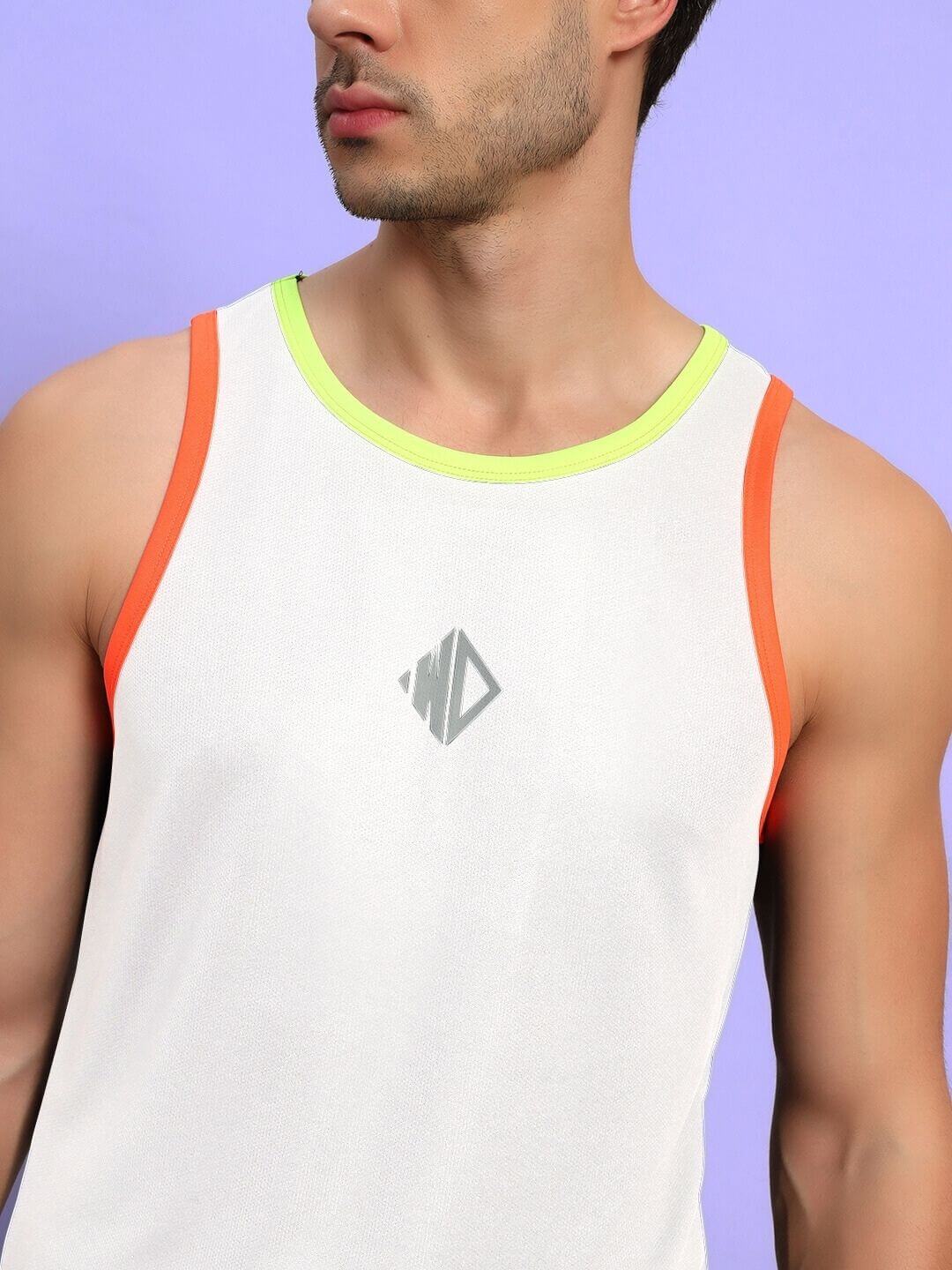 Model wearing JORDAN GYM REGULAR FIT CO-ORD SET WHITE tank top with orange and neon trim, showing athletic style.