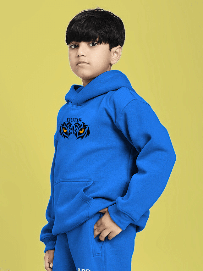 Child wearing A JOURNEY WITHIN FLEECE HOODIE FOR BOYS AND GIRLS BLUE, posing against a yellow background, showcasing the hoodie design.