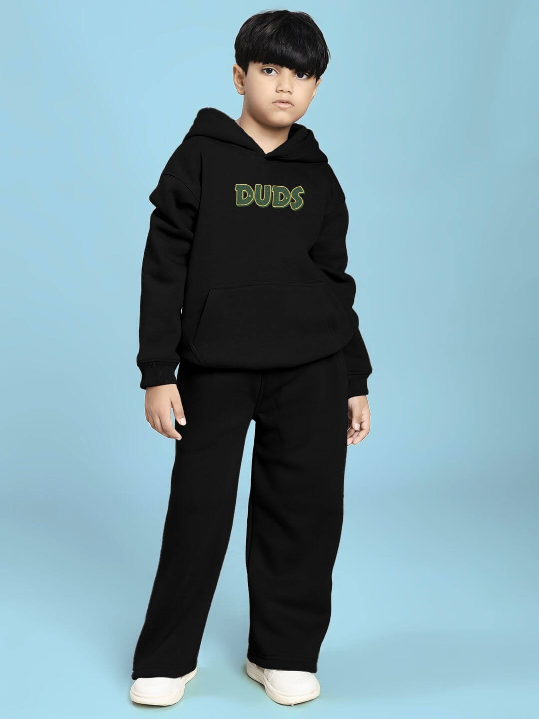 Child wearing JUDY NICK ZOOTOPIA FLEECE CO-ORD FOR BOYS AND GIRLS BLACK with hoodie and pants, featuring cozy cartoon style.