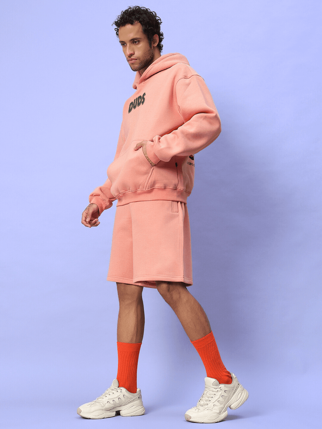 Model wearing JUDY NICK ZOOTOPIA FLEECE CO-ORD PEACH set, showcasing playful streetwear style in soft peach color.