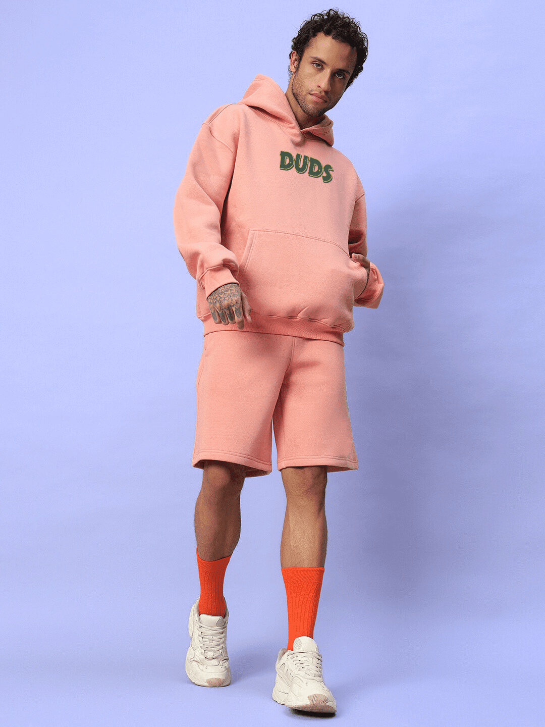JUDY NICK ZOOTOPIA FLEECE CO-ORD PEACH modeled by person, showcasing playful character style in soft peach color, unisex outfit.