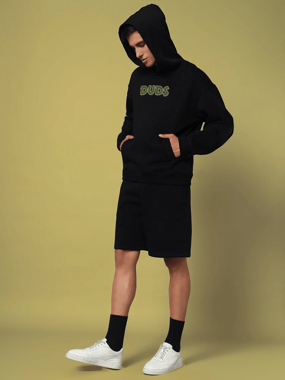 Model wearing JUDY NICK ZOOTOPIA FLEECE HOODIE BLACK for men and women, showcasing modern streetwear with cartoon nostalgia.