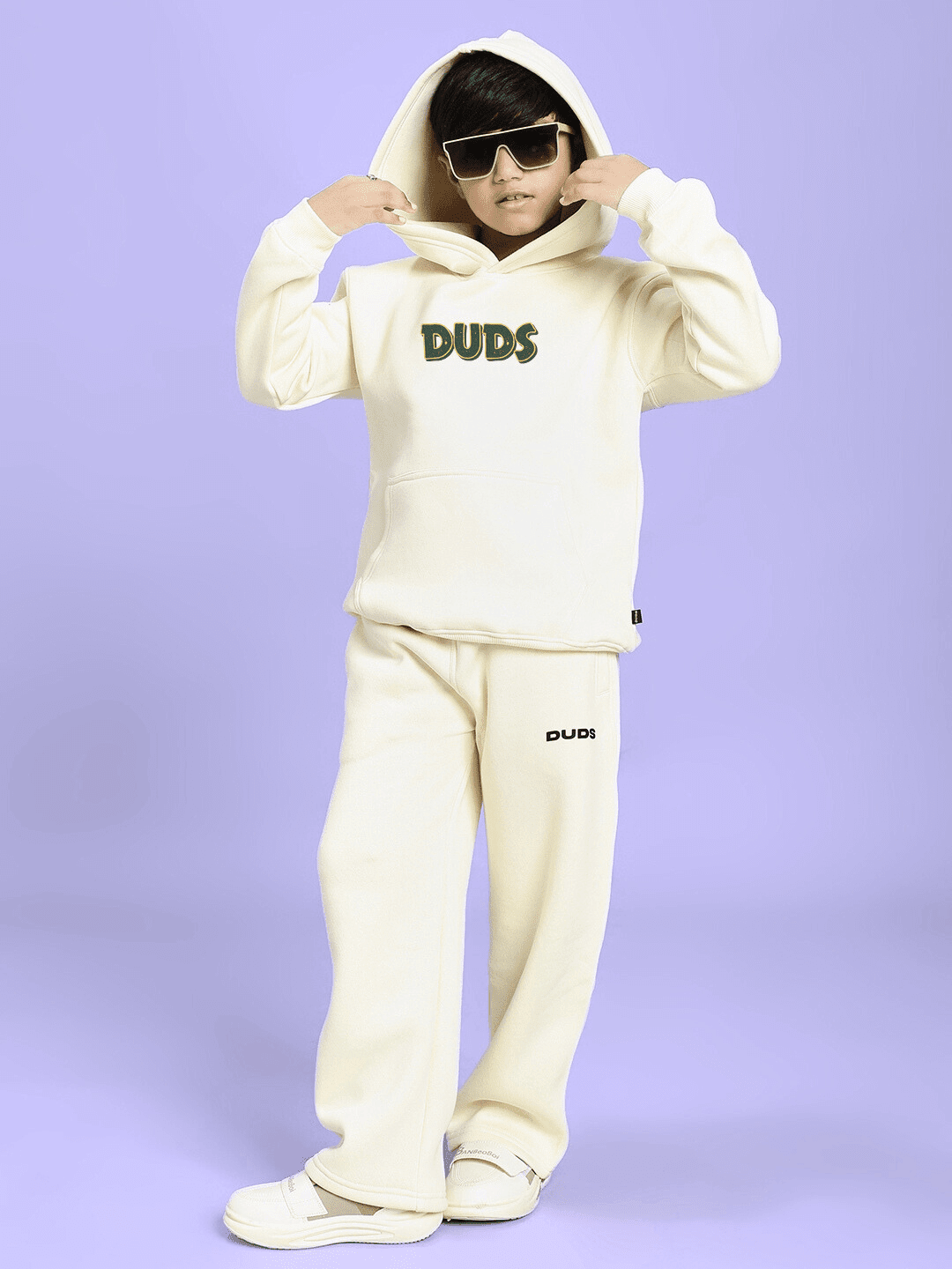 Child wearing JUDY NICK ZOOTOPIA FLEECE CO-ORD FOR BOYS GIRLS OFF WHITE with hoodie and pants, stylish kidswear set.