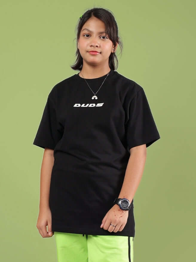 JUMBO T-SHIRT FOR BOYS & GIRLS BLACK on model, modern oversized fit for casual wear.