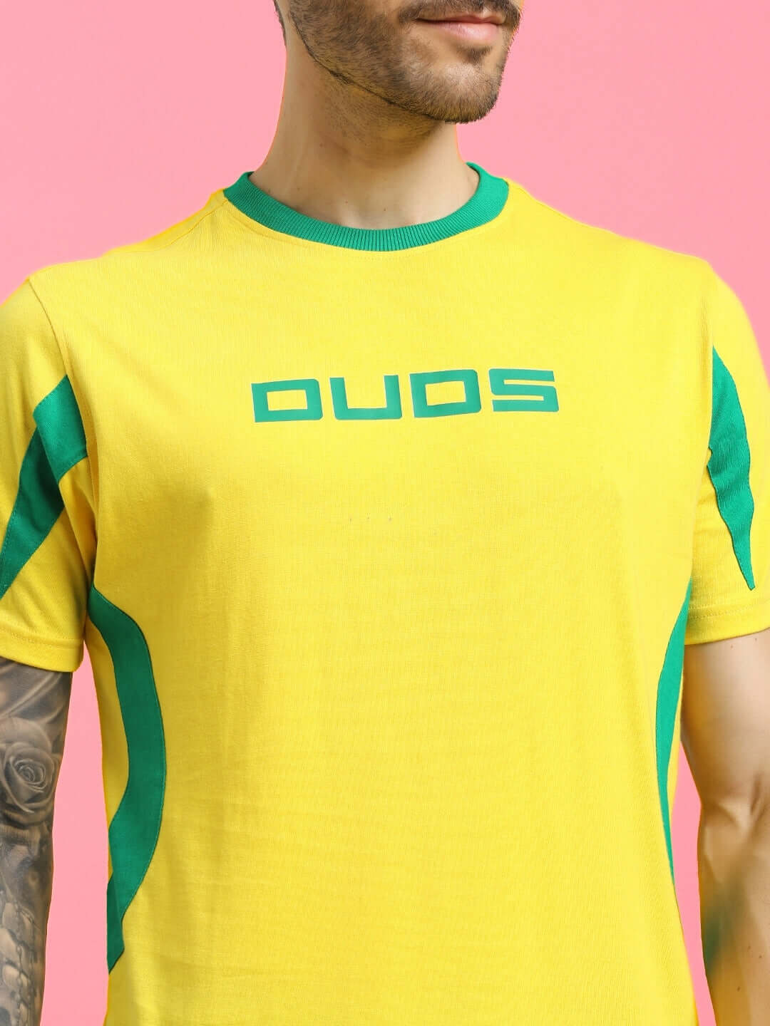 Man wearing JUMPY REGULAR FIT T-SHIRT YELLOW with green accents, featuring breathable cotton fabric for comfort and style.