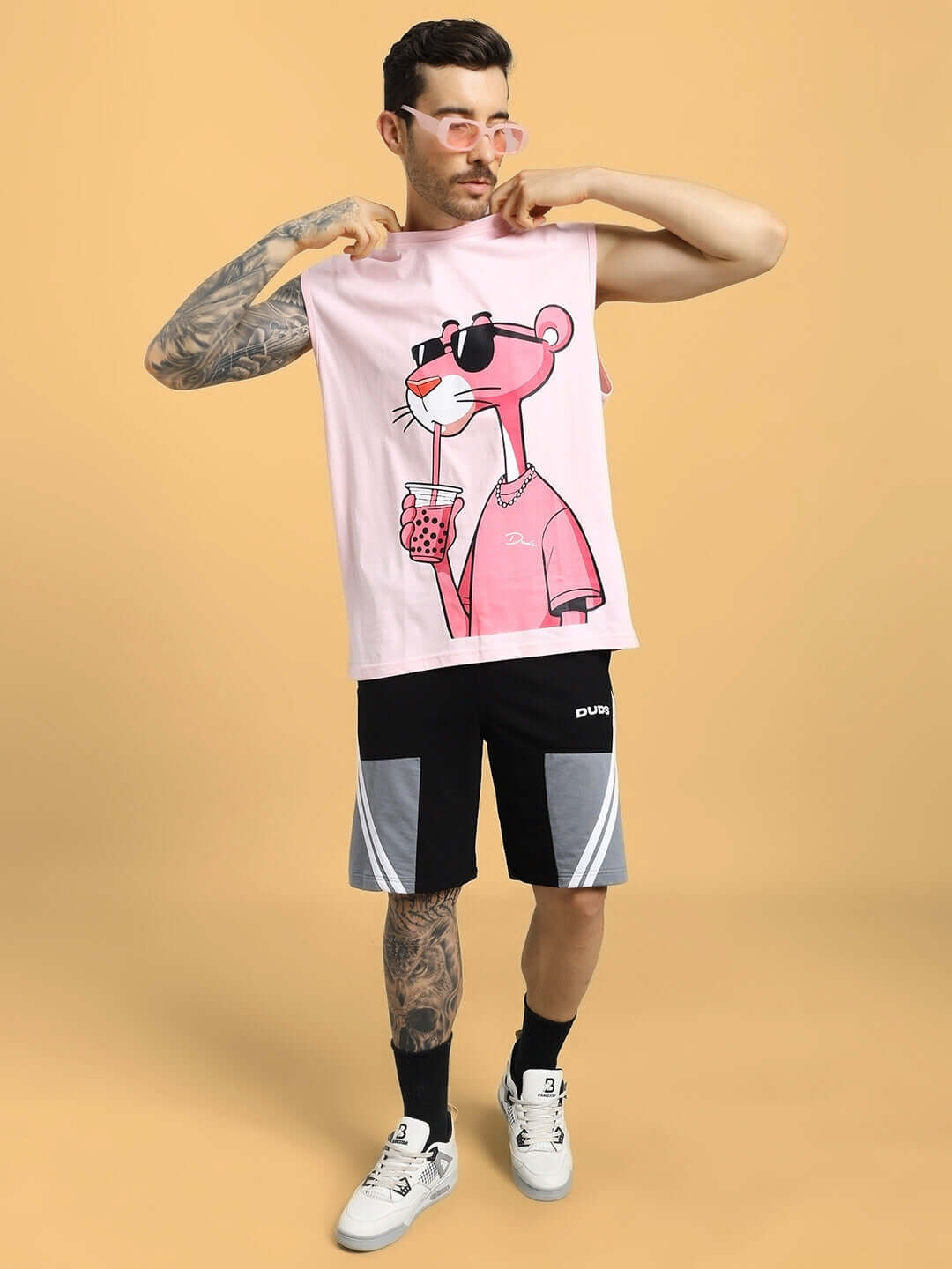 Model wearing Just Chill Pink Panther Printed T-Shirt Pink showcasing iconic cartoon design, perfect for casual wear.