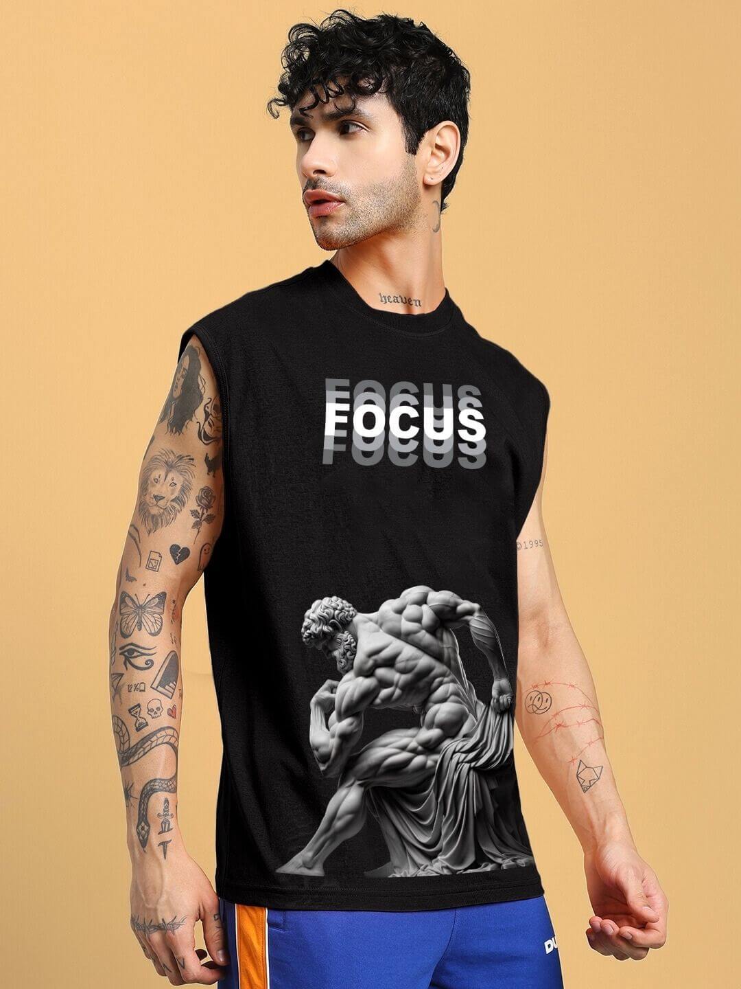 Model wearing JUST FOCUS fine black T-shirt featuring artistic print, customizable size for custom fit, handmade craftsmanship by DUDS.