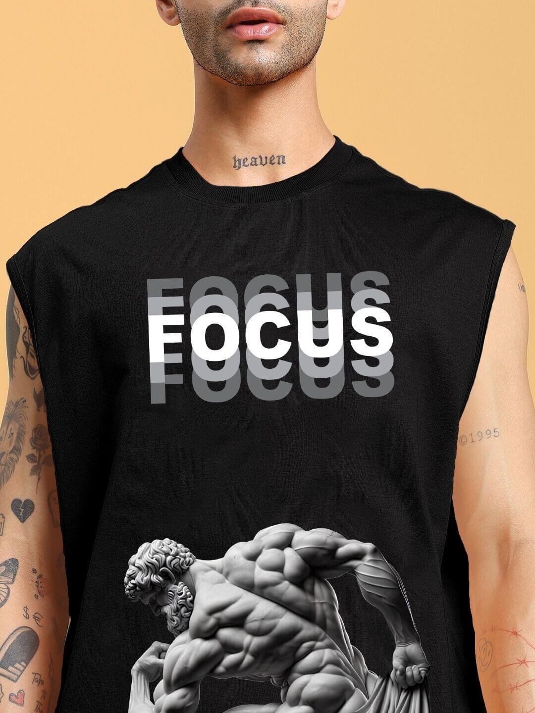 Close-up of a black sleeveless t-shirt with 'FOCUS' text and Greek sculpture design.