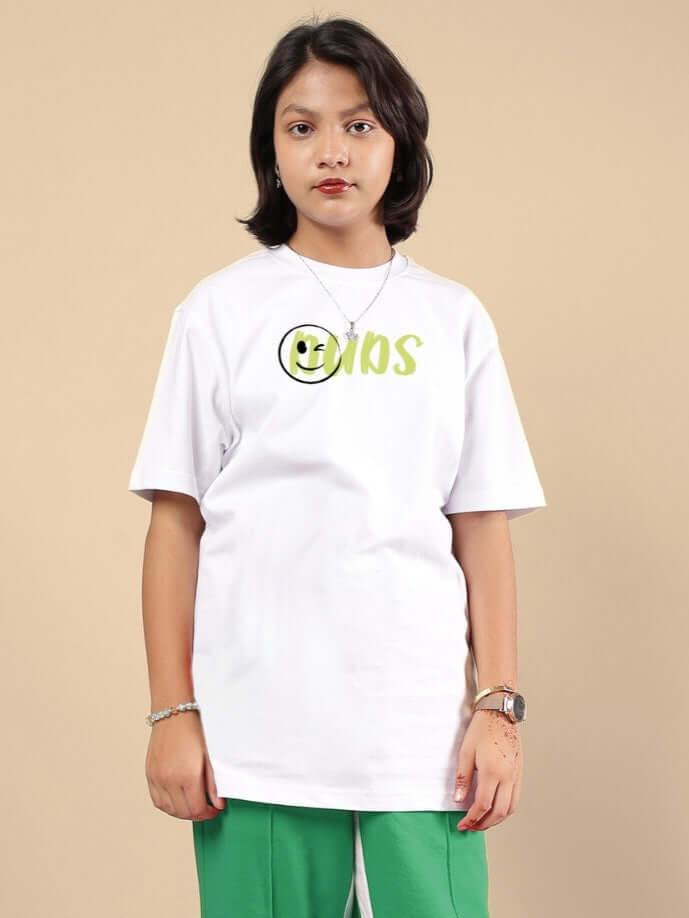 Child wearing the JUST WANNA BE T-SHIRT FOR BOYS & GIRLS WHITE, showcasing carefree style and simplicity with bold print