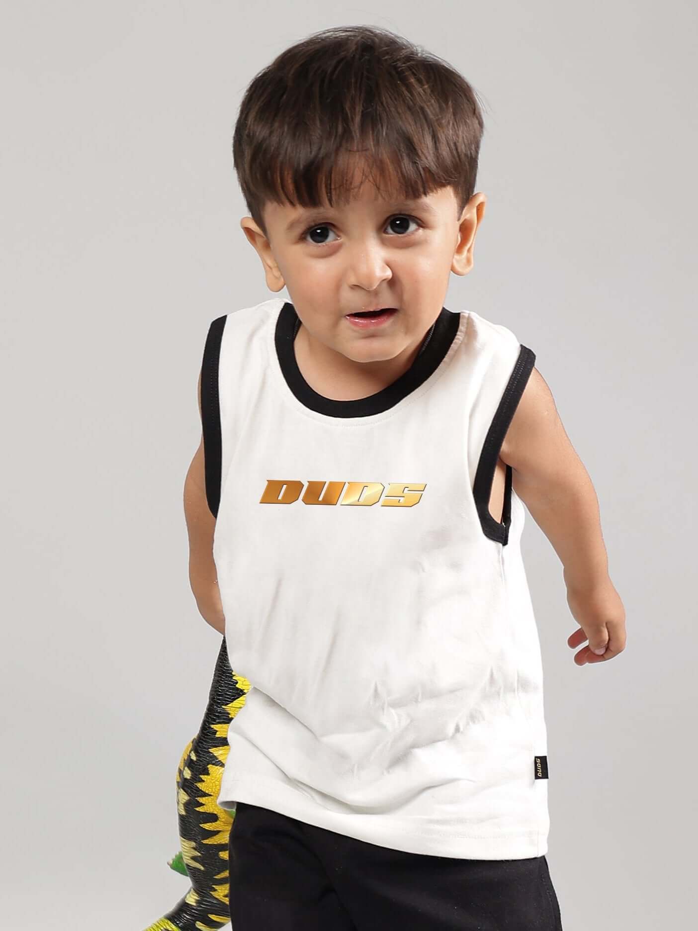 Young boy wearing KEVIN SUMMER T-SHIRT FOR BOYS GIRLS OFF WHITE, showcasing casual summer style with a modern off-white cotton tee.