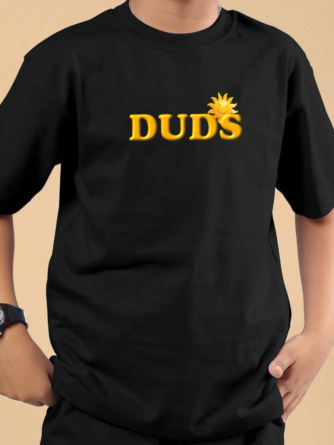 Child wearing LABUBU Monsters black co-ord set by DUDS, featuring yellow 'DUDS' logo on the front.