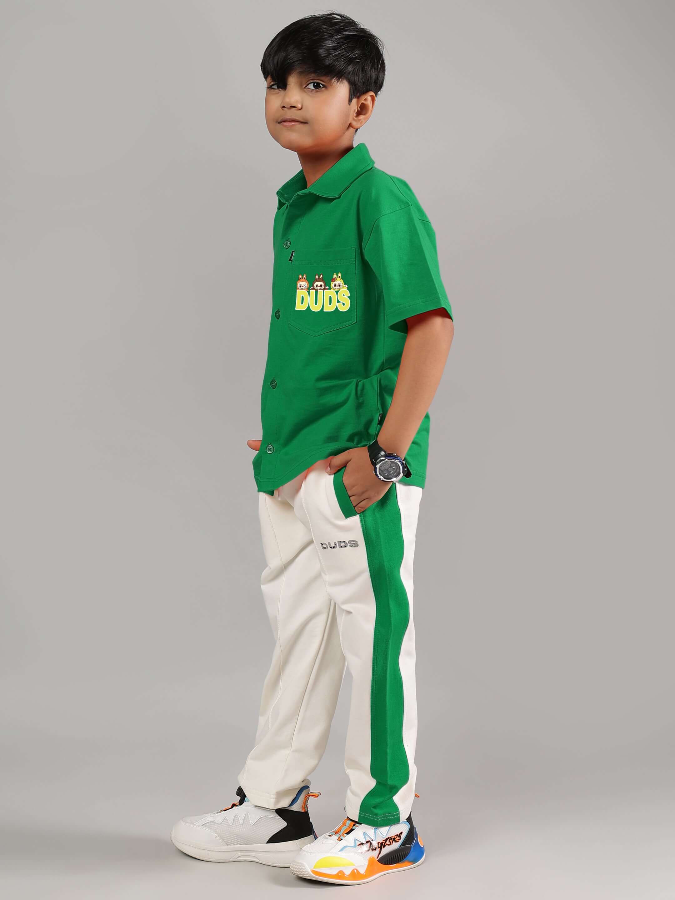 Child wearing LABUBU MYSTERY CO-ORD FOR BOYS GIRLS GREEN-OFF-WHITE outfit showing side view.