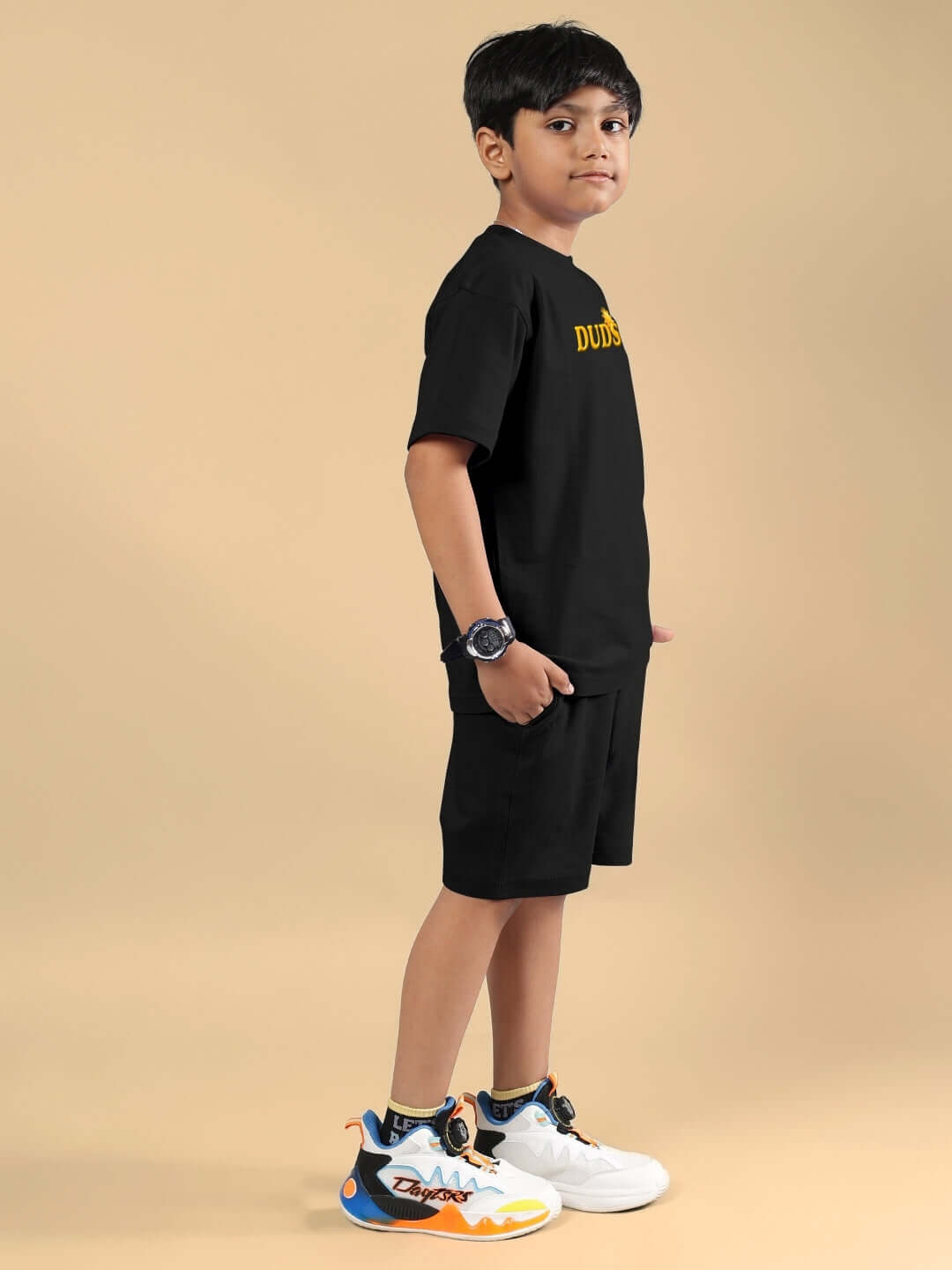Boy wearing LABUBU Monsters Co-Ord in black, featuring a T-shirt and shorts. Ideal for boys and girls, custom fit options available.