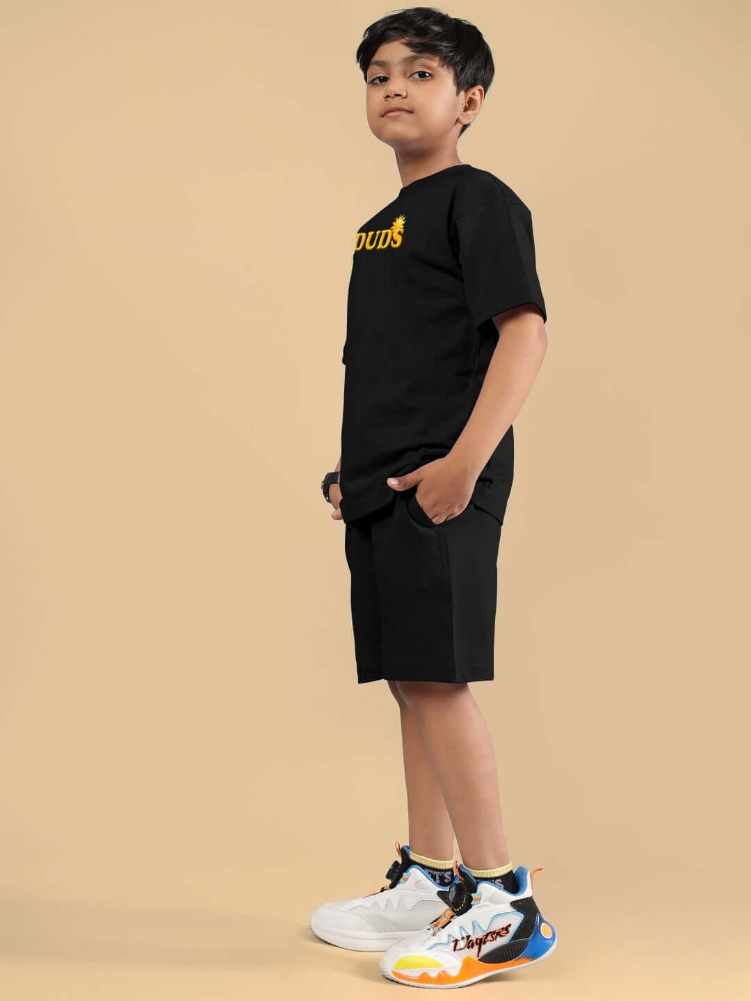 Boy wearing LABUBU MONSTERS black co-ord set, side view. Ideal for boys and girls, tailored by DUDS with a custom fit option.