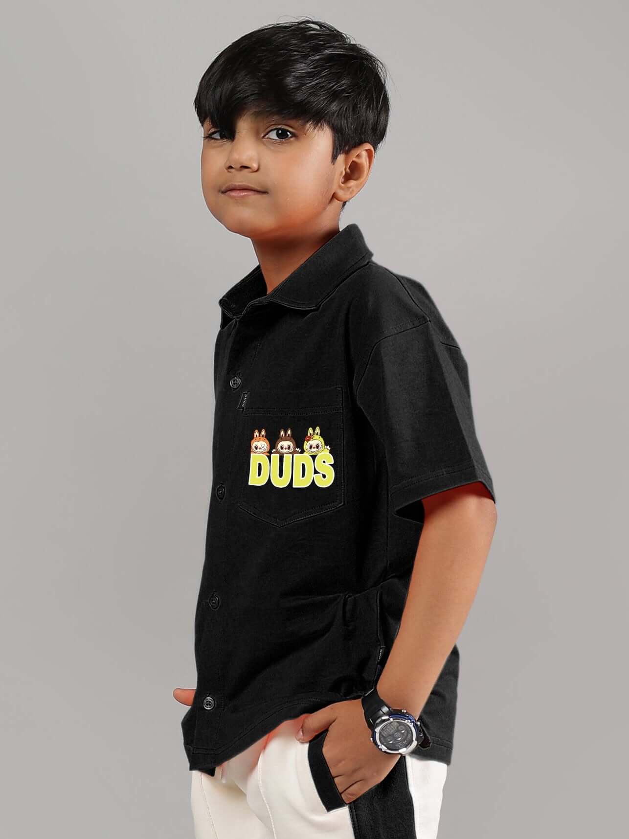 Child wearing black LABUBU Mystery Shirt for Boys & Girls by DUDS, featuring fun graphic design.