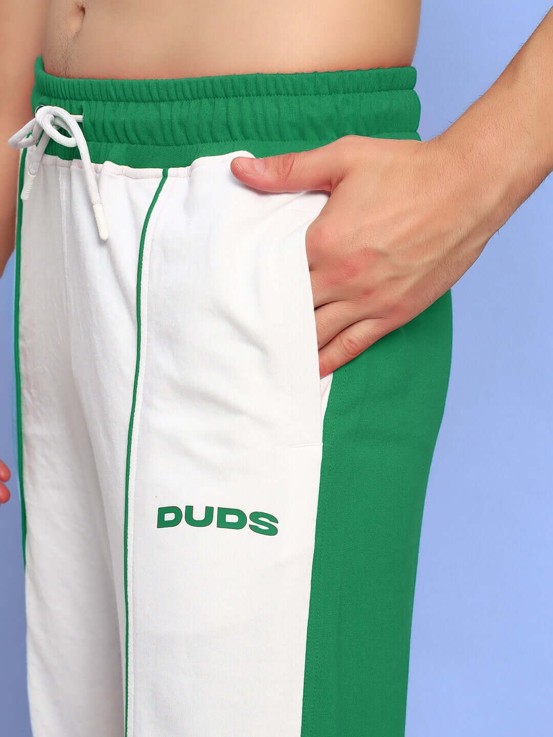 Man wearing Lagoon Relaxed Fit Joggers White Green by DUDS showing close-up of side pocket design and waist tie.