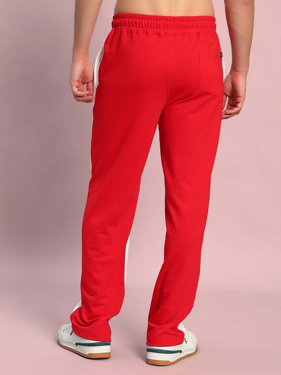 Back view of model wearing Lagoon Relaxed Fit Joggers in white red color, showcasing comfortable design and elastic waistband fit.