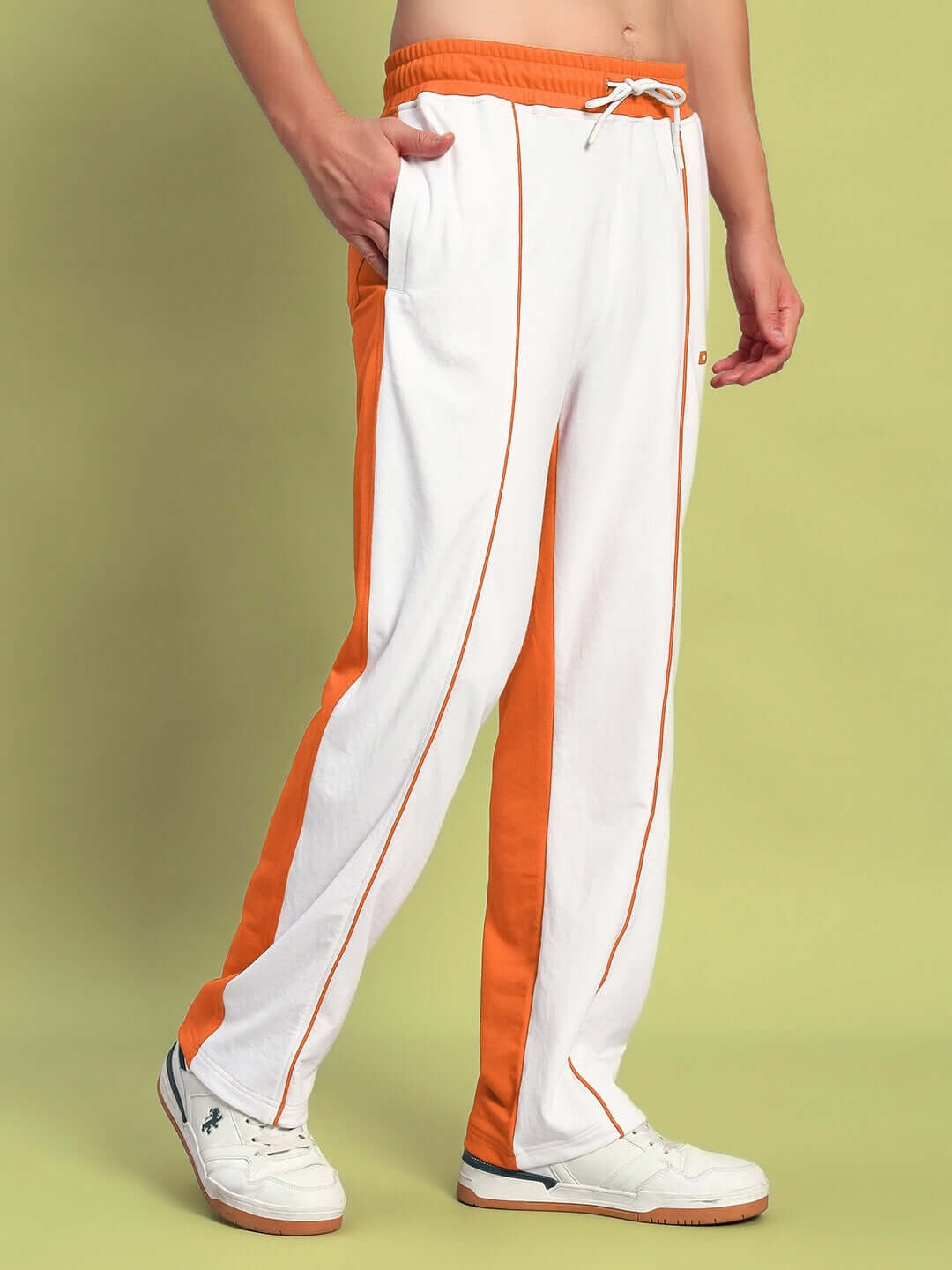 Lagoon relaxed fit joggers in white and orange, featuring comfortable elastic waistband, modeled on a neutral background.